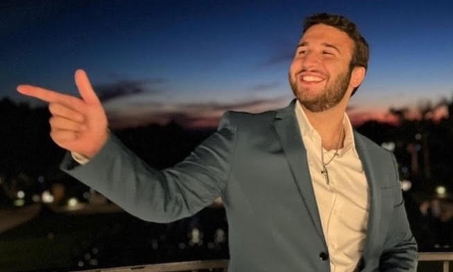 A headshot of Christopher Tams